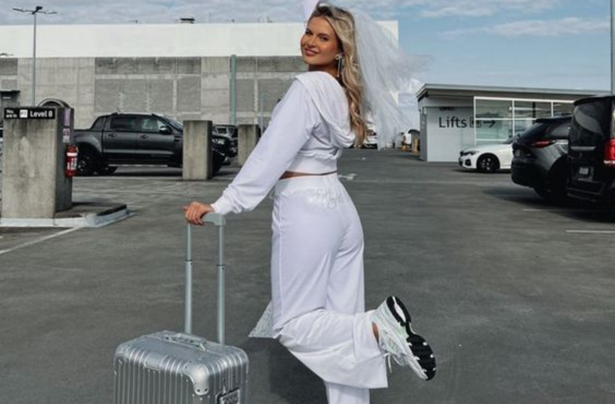 bride wearing airport outfit for bachelorette