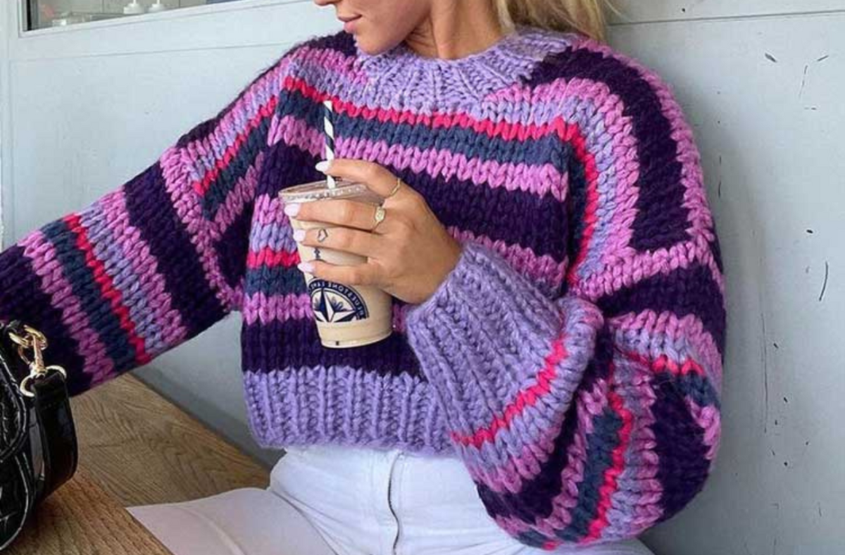 blonde women wearing purple chunky knit sweater
