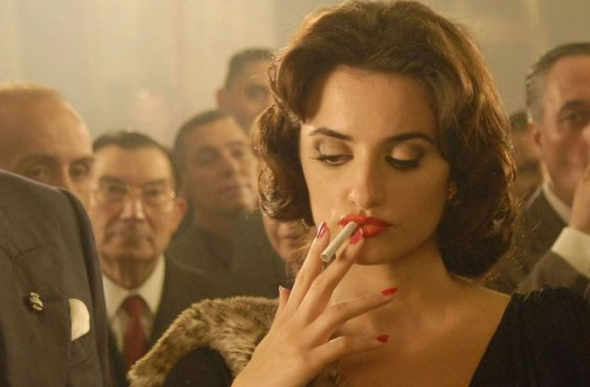 mob wife wearing fur coat at dinner