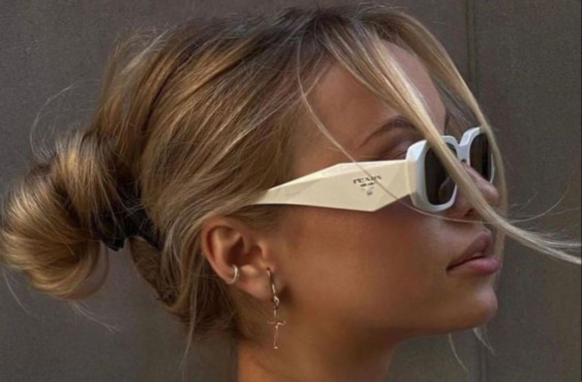 blonde women wearing white prada sunglasses