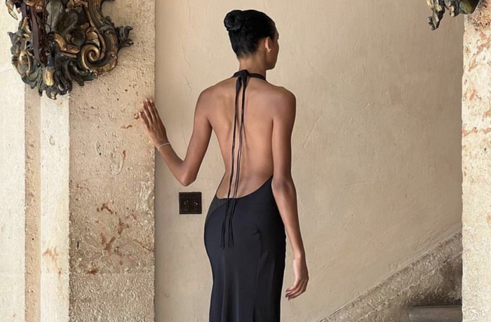 women wearing black low back gown
