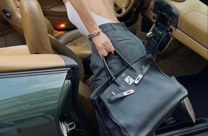 mom holding extra large birkin bag black