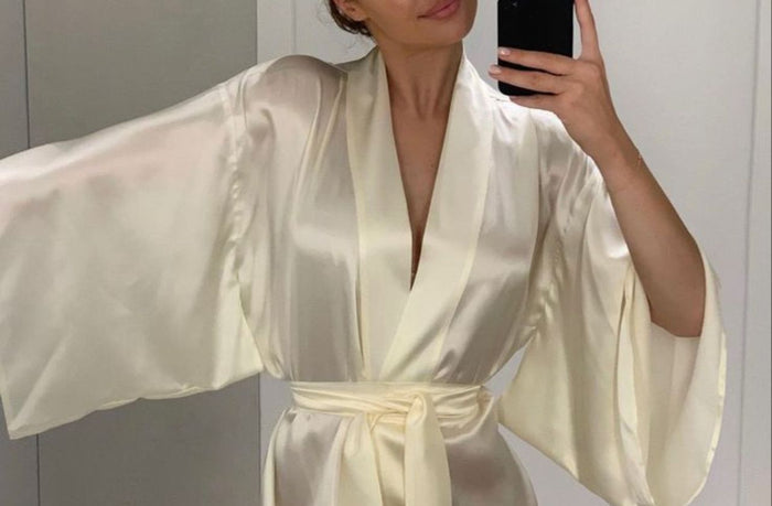 petite women wearing cream silk robe pajama