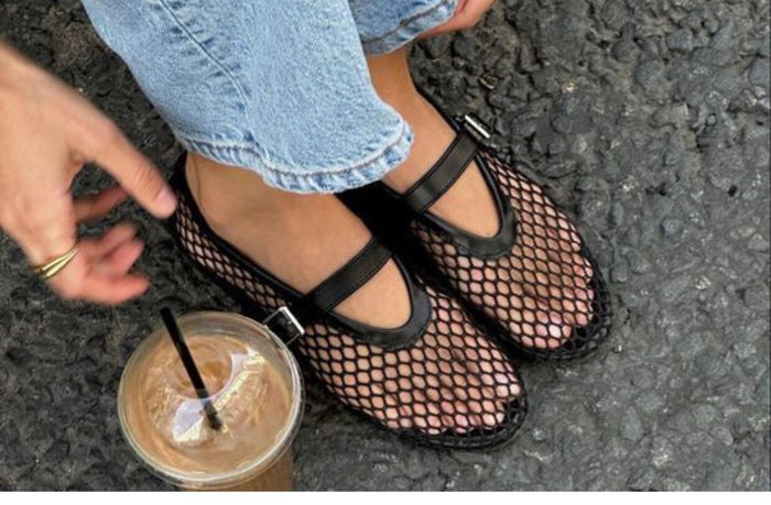 women wearing black fishnet ballet flats on the street