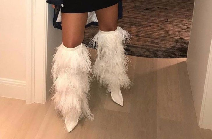Rihanna in thigh high fur boots 