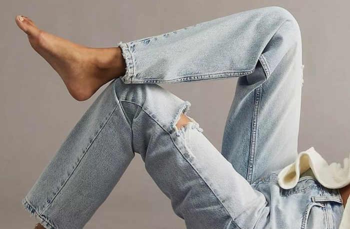 women wearing light wash stretch jean