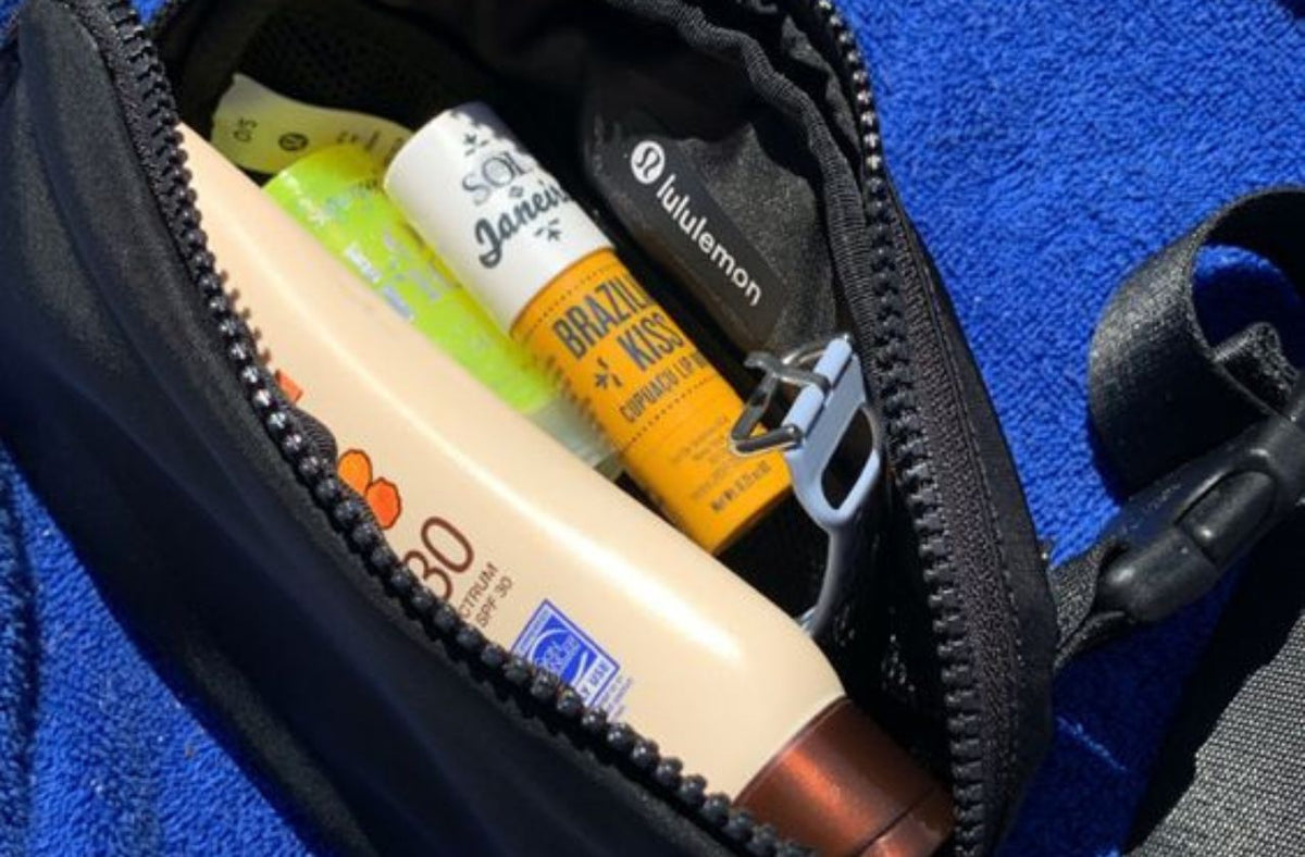 lululemon belt bag with wallet chapstick and sunscreen inside