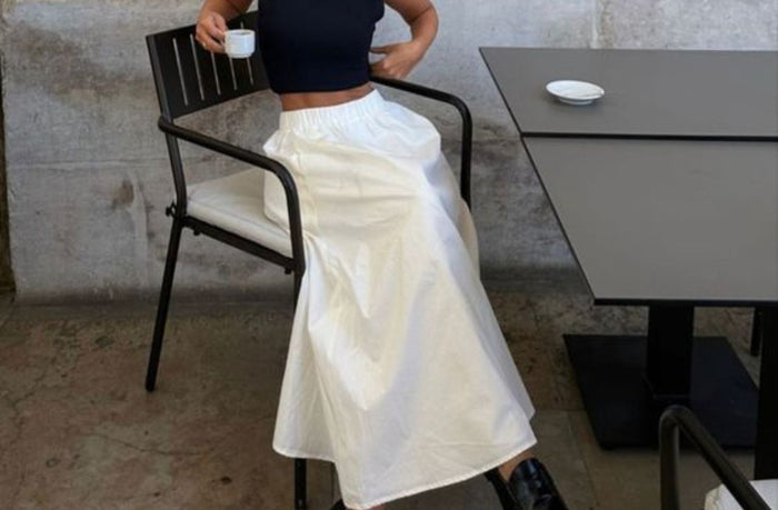 women wearing high rise linen maxi skirt with black t shirt