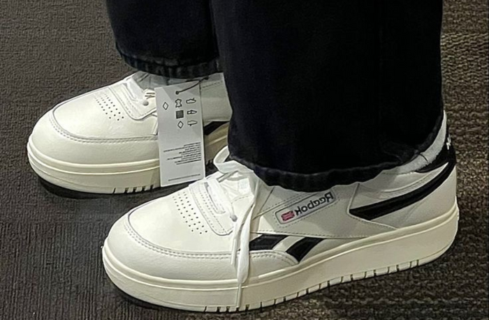 short women wearing white platform sneaker